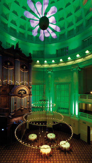 A green light emits from the Philips decorative lighting products in this room at the Renaissance Hotel