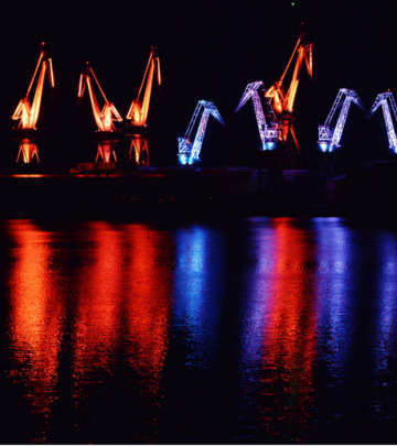 Cranes in the seafront at Pula, Croatia nicely lit with Philips outdoor lighting