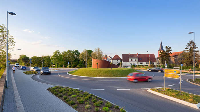 Cars entering a parking lot